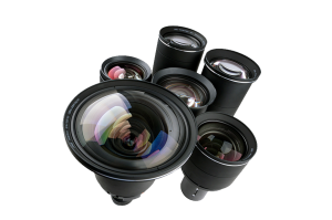 A set of six camera lenses of different sizes is arranged on a white background, with the largest lens placed at the front and smaller lenses behind it. Each lens features clear, reflective glass surfaces. Perfect for photographers seeking a versatile camera lens kit.