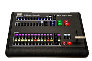 Black Barco EC-30 Event Controller featuring labeled buttons, illuminated colorful keys, sliders, switches, and a metal lever on the right side; top labels display EC-30 Event Controller and Event Master Series.