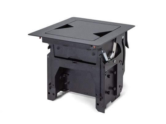 Black metal tabletop power and data outlet module with a square cover, designed to be recessed into a table for seamless access to multiple connectivity ports.