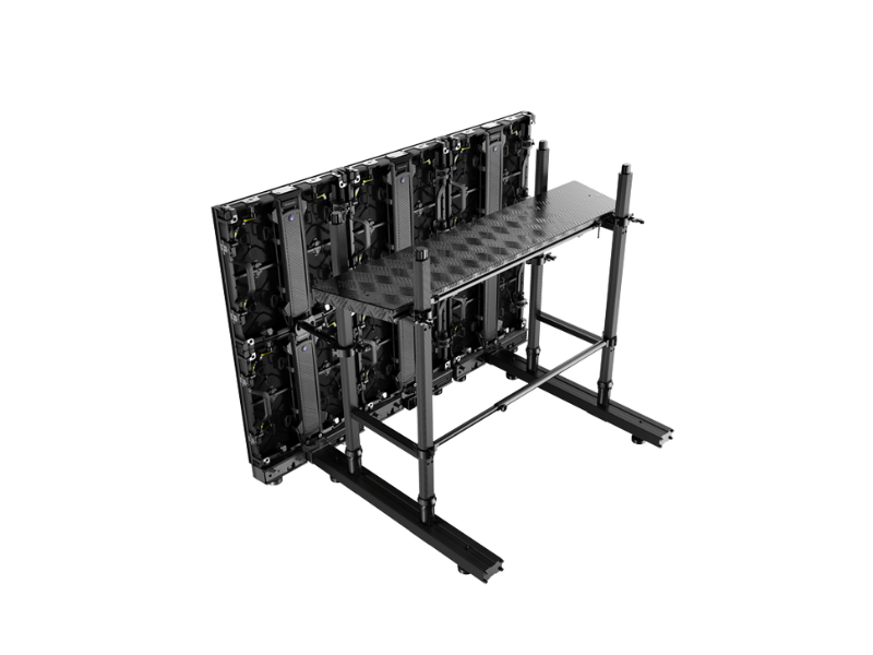 Large black metal frame supporting a vertical LED display panel with visible electronic components, featuring an attached work platform and sturdy base; structure is shown isolated on a white background. Ideal for digital signage installation or maintenance.